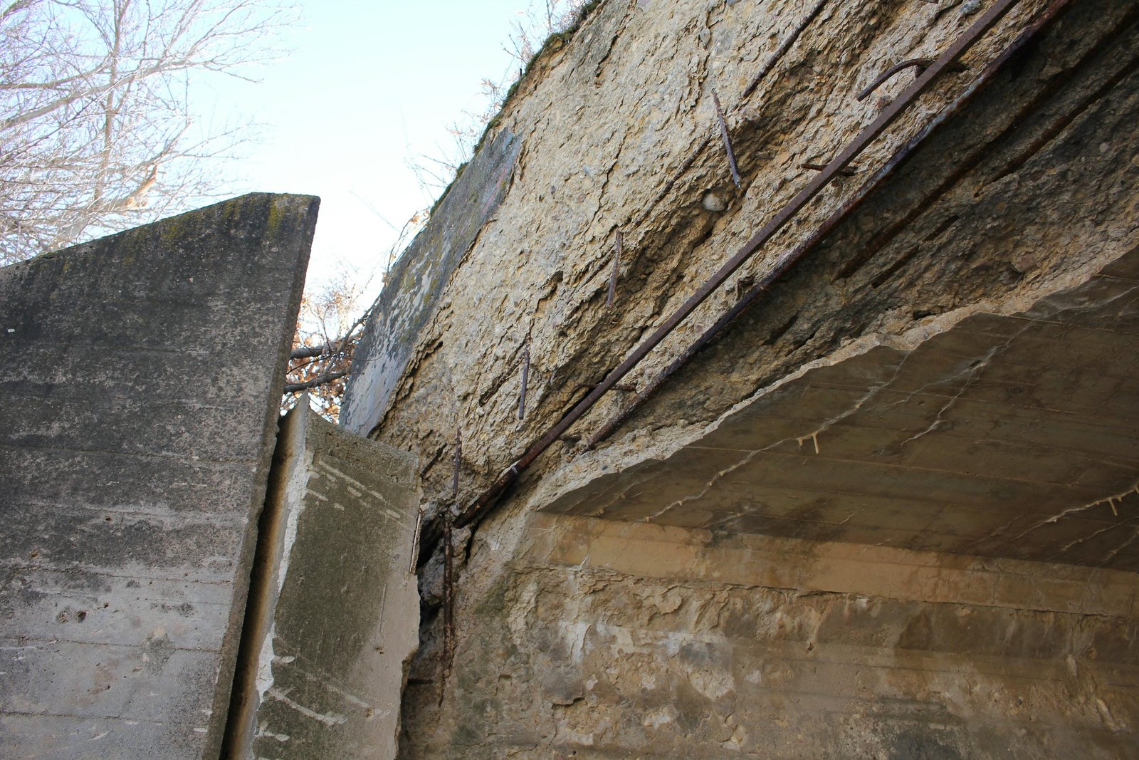 Severe spalling showing exposed ransome rebar and separation at northeast wing wall